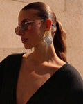 Aretes de conchas y cowboy
