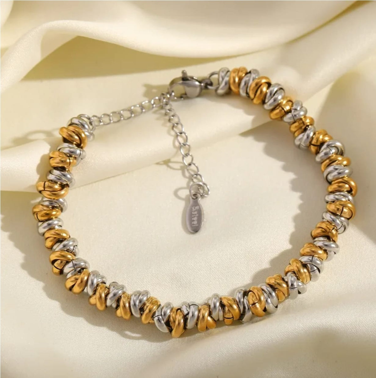 Pulsera tres tonos con diseño entrelazado